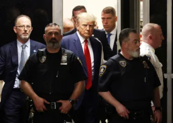 epa10558601 Former US President Donald J. Trump walks towards the courtroom inside New York Criminal Court in New York, New York, USA, 04 April 2023. A Manhattan grand jury voted to indict former President Donald J. Trump last week and he will turn himself in at the courthouse and appear before a judge to hear the charges against him later today.  EPA/JUSTIN LANE