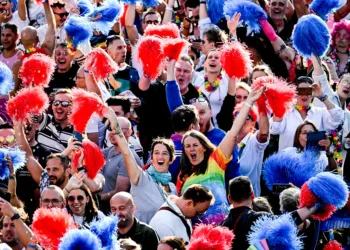 epa10758675 Participants of the Berlin Canal Pride cheer onboard a boat on the Spree River ahead of the 'CSD Berlin 2023' pride parade in Berlin, Germany, 20 July 2023. The 45th Christopher Street Day (CSD) in Berlin takes place on 22 July 2023.  EPA/FILIP SINGER