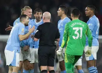 epa11009677 Manchester City players argue with the referee during the English Premier League soccer match between Manchester City and Tottenham Hotspur, in Manchester, Britian, 03 December 2023. EPA/PETER POWELL EDITORIAL USE ONLY. No use with unauthorized audio, video, data, fixture lists, club/league logos, 'live' services or NFTs. Online in-match use limited to 120 images, no video emulation. No use in betting, games or single club/league/player publications.